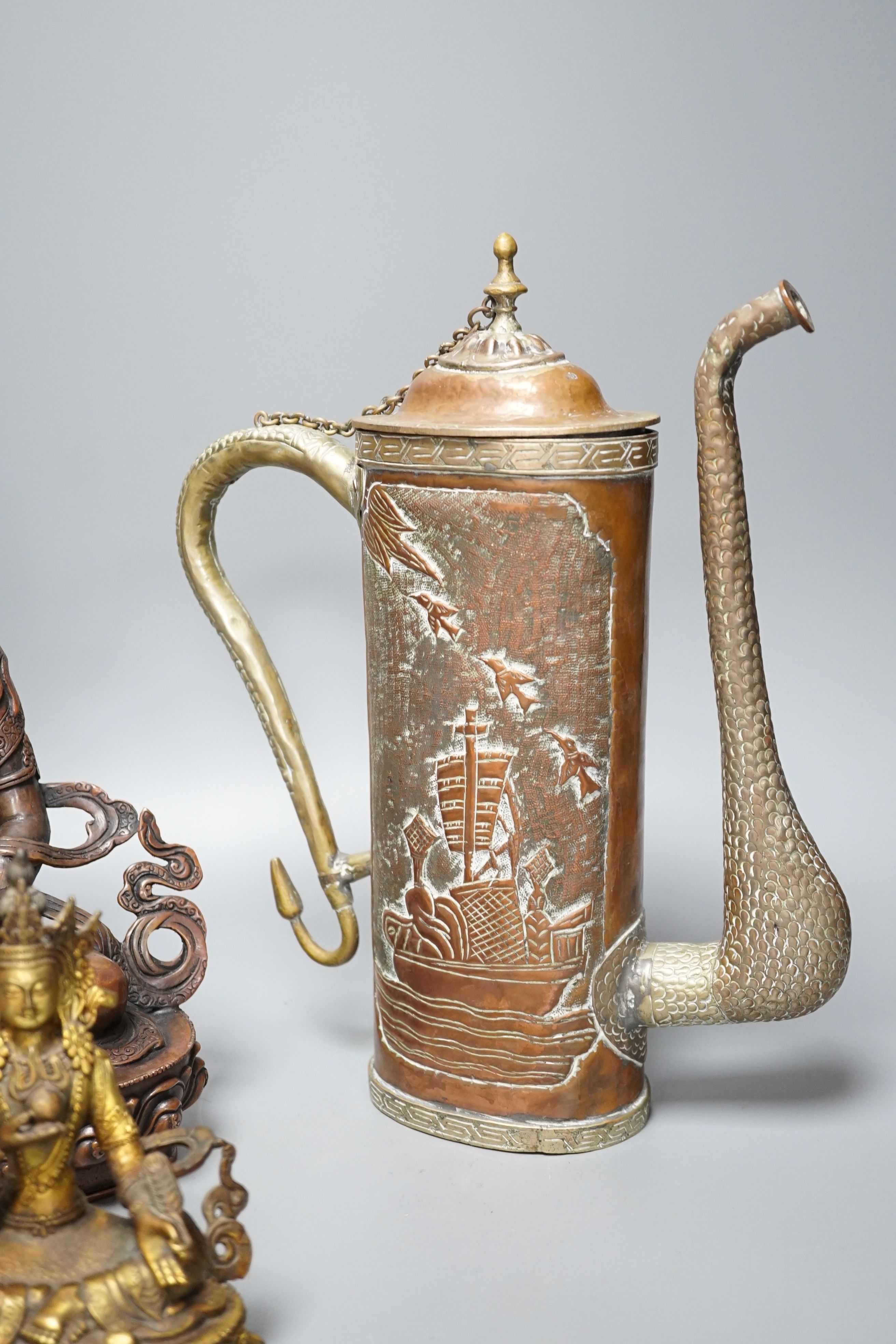 A Tibetan copper and brass ewer, together with a gilt-metal bodhisattva and another bronze bodhisattva, tallest 31cm